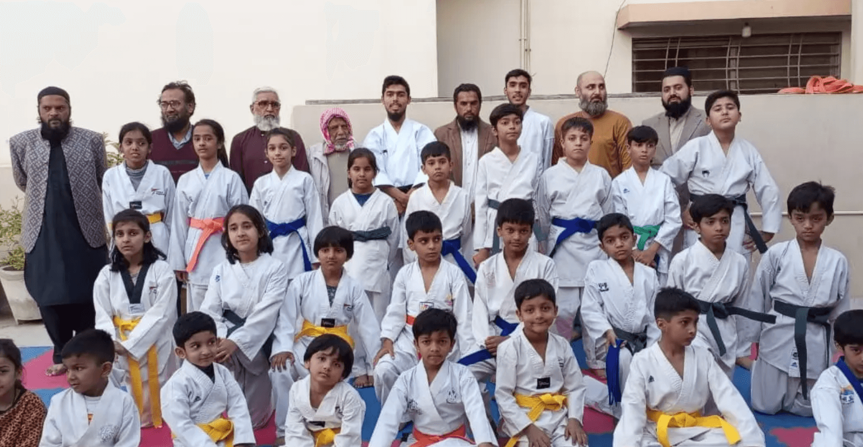 Al Hakam Academy students group photo with instructors